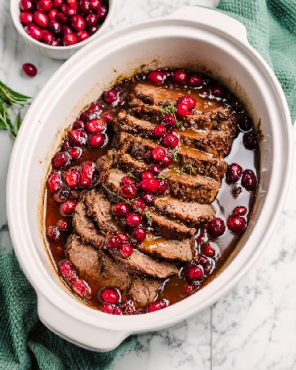 The image shows a white oval dish filled with slices of cooked meat arranged neatly in a row. The meat is covered with a glossy brown sauce, and bright red cranberries are scattered on top, adding vibrant color. The dish sits on a white marbled surface with a hint of green cloth in the background. Photo taken with an iphone --ar 4:5 --v 7